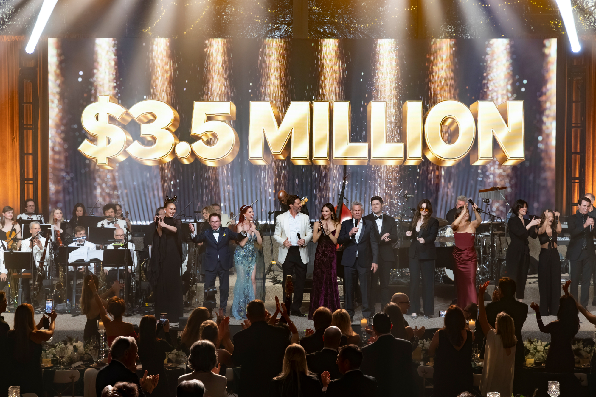 From left to right: Loren Allred, Richard J Stephenson, Dr. Stacie J. Stephenson, Hugh Jackman, Katharine McPhee, David Foster, Daniel Emmet, Julie Falcon, and Sydnie Christmas / Source: Gateway for Cancer Research  (EZ Newswire)
