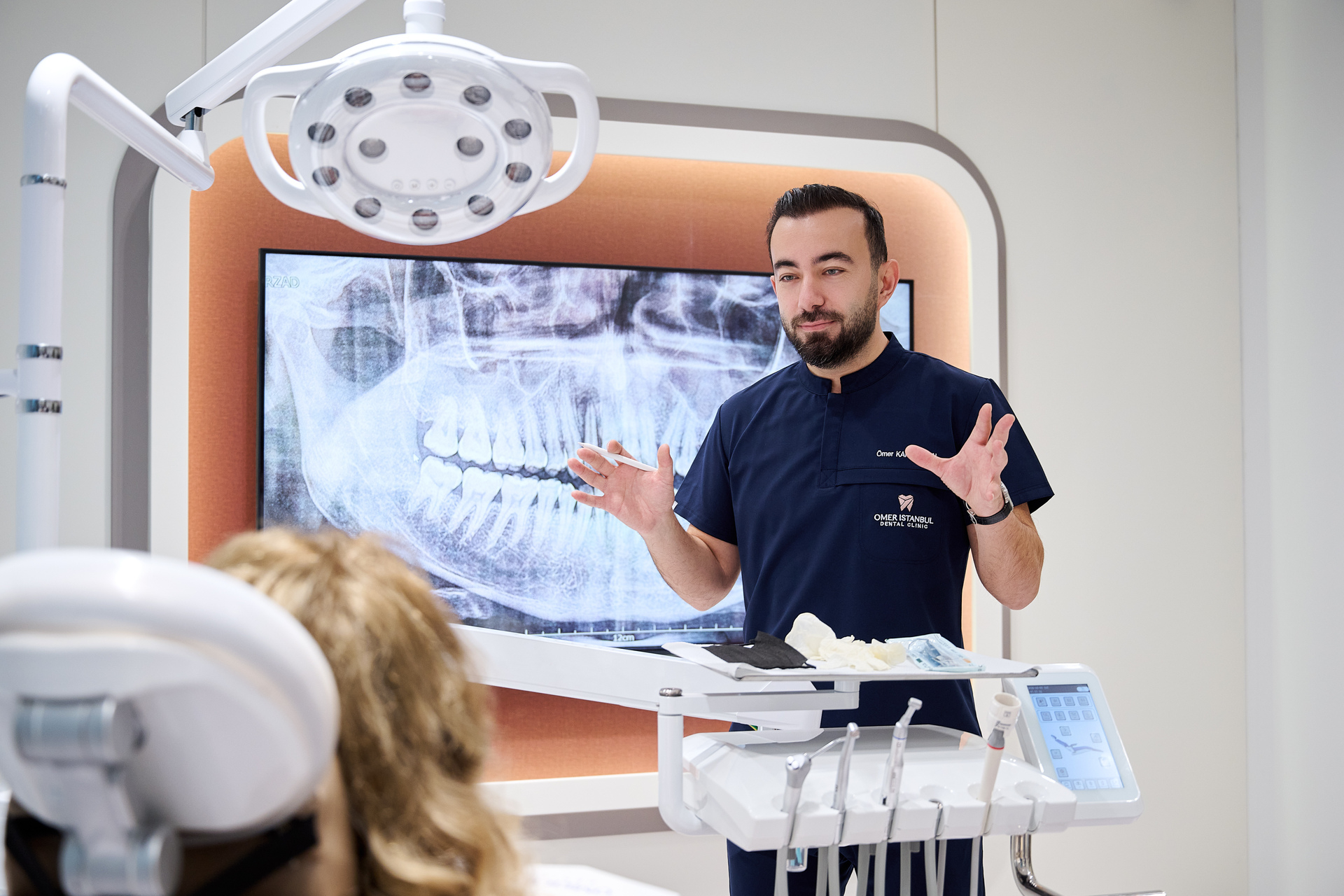 Dr. Omer Karaaslan, founder and Chief Dentist of Omer Istanbul Dental Clinic, discussing a dental X-ray with a patient at the clinic’s new facility in Istanbul / Source: Omer Istanbul Dental Clinic (EZ Newswire)